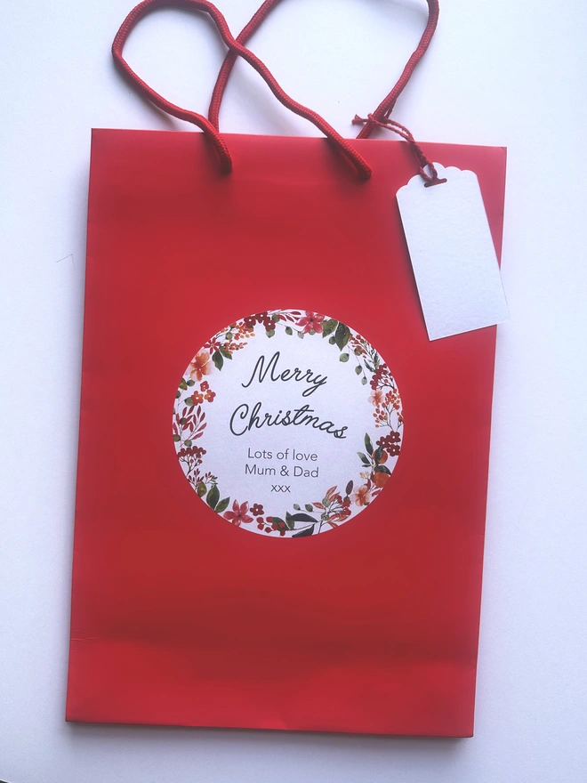 Personalised gift bag with gift tag in red