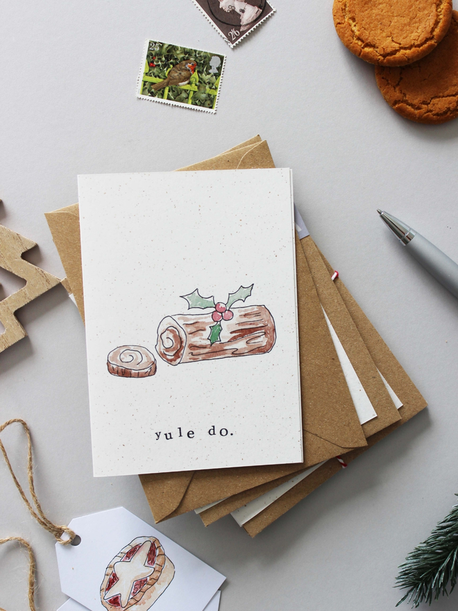 'Yule Do' Card on stack of Christmas cards