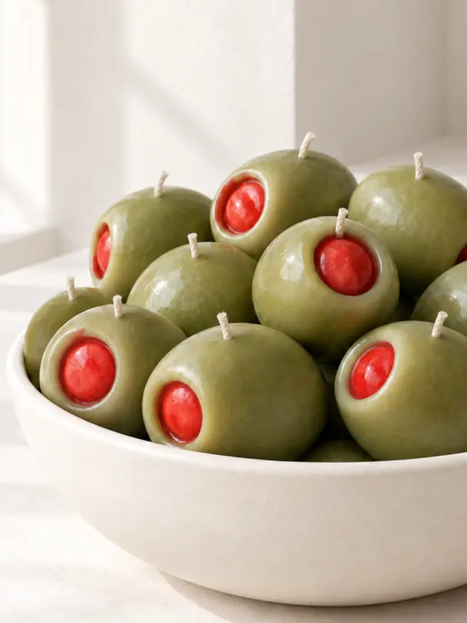 large new olive candles in a bowl