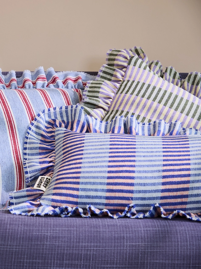 Blueberry Pie Cushion. Multiple cushions. Blueberry pie is at the forefront.