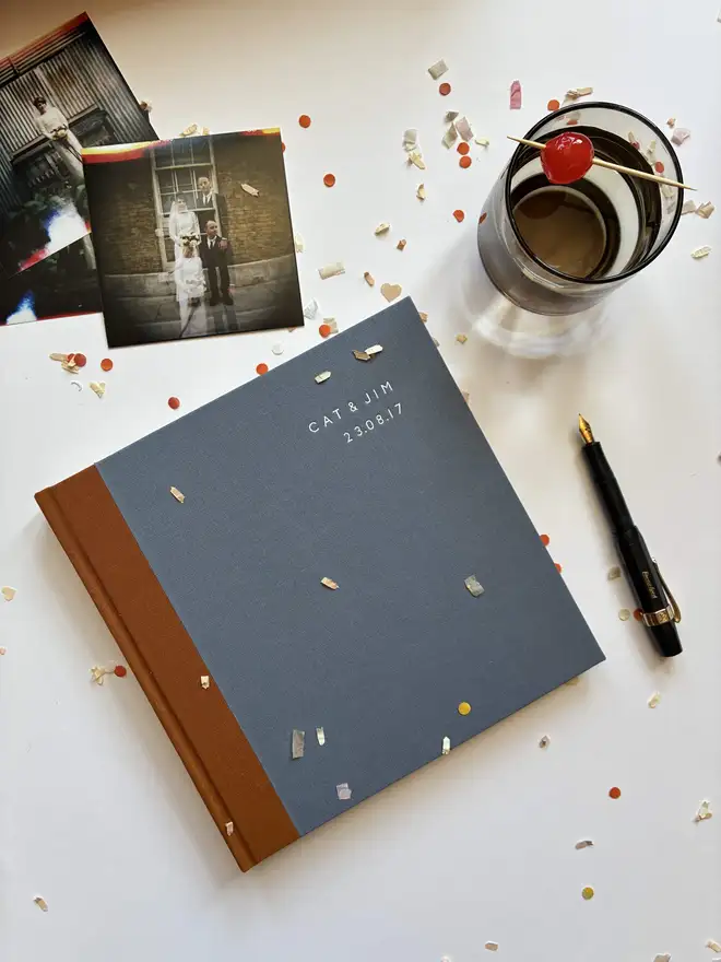 Instant photo guestbook by Keep Collect in Nutmeg and Steel Blue book cloth with cocktail and photographs