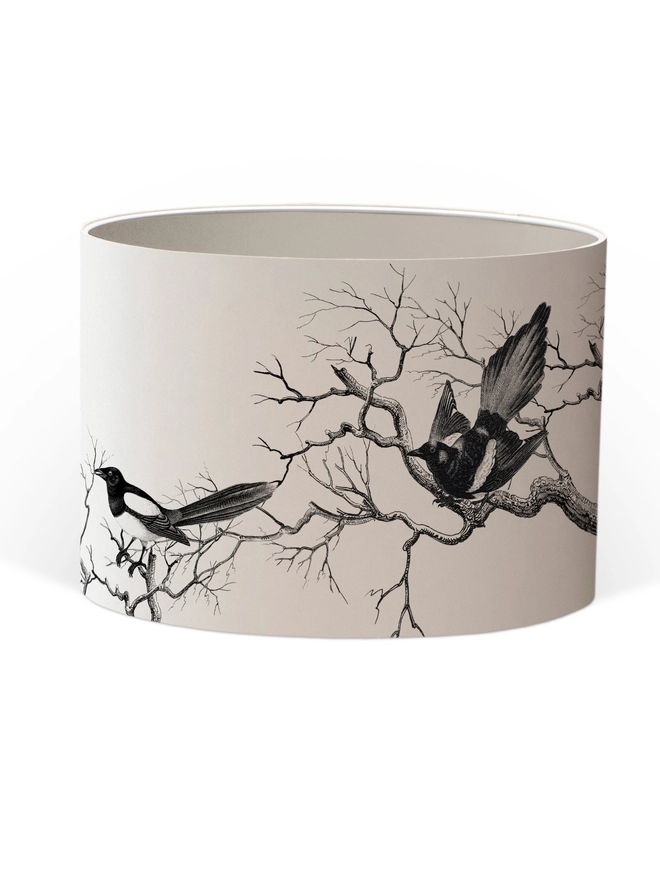 Drum Lampshade featuring magpies sitting on branches with a white inner on a white background