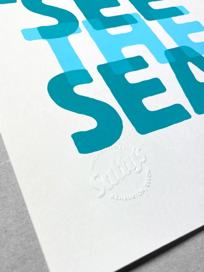 Close up of I Can See the Sea A4 print, the embossed branded stamp in the lower left corner 
