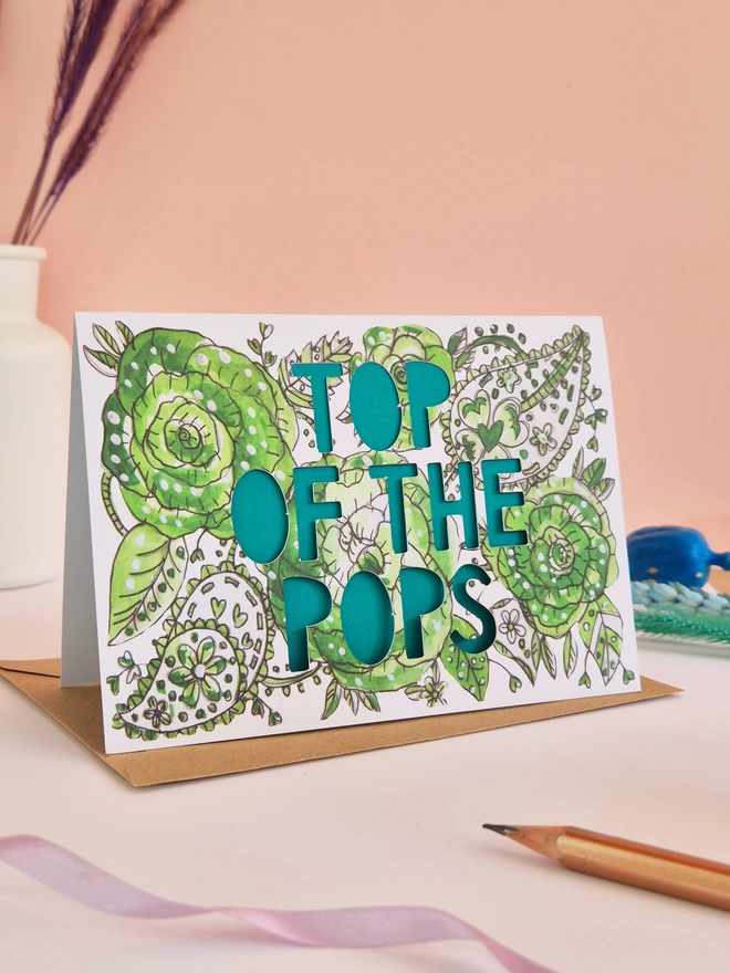 green paisley illustration print greeting card with Top of the Pops Paper cut text and green paper liner 