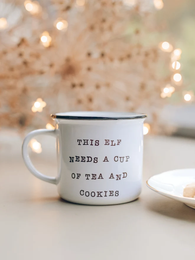 Christmas ceramic mug with words 'this elf needs a cup of tea and cookies'