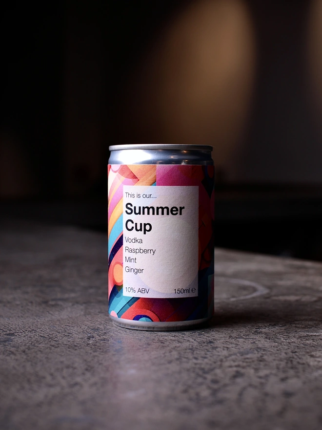 Can of Summer Cup photographed on concrete against a dark background