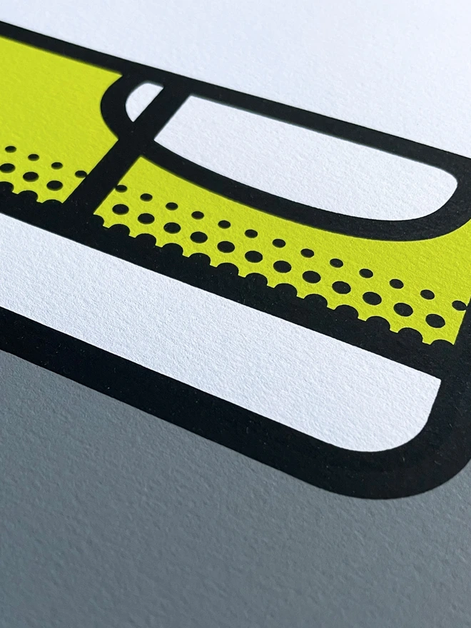 Close up of screenprint of a spirit level in grey, yellow and black ink. Showing the texture of the high quality paper and sharpness of the print.