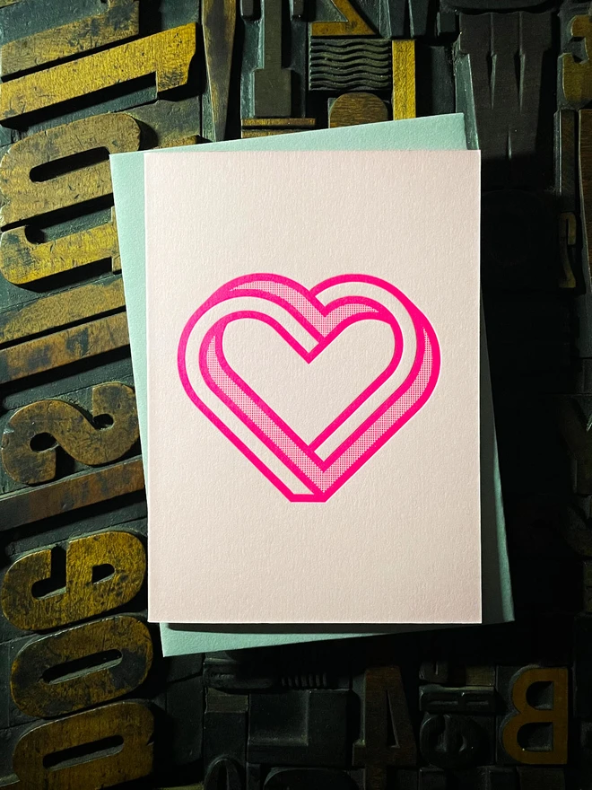 Valentine! A beautiful infinity heart monogram letterpress card printed with rich fluorescent pink ink on thick Candy Pink card with a luxury matching envelope; ideal to send a to a friend or loved one.