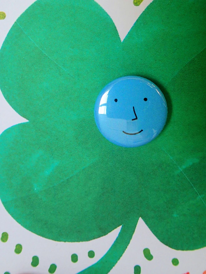 lucky clover good luck card with face pin badge