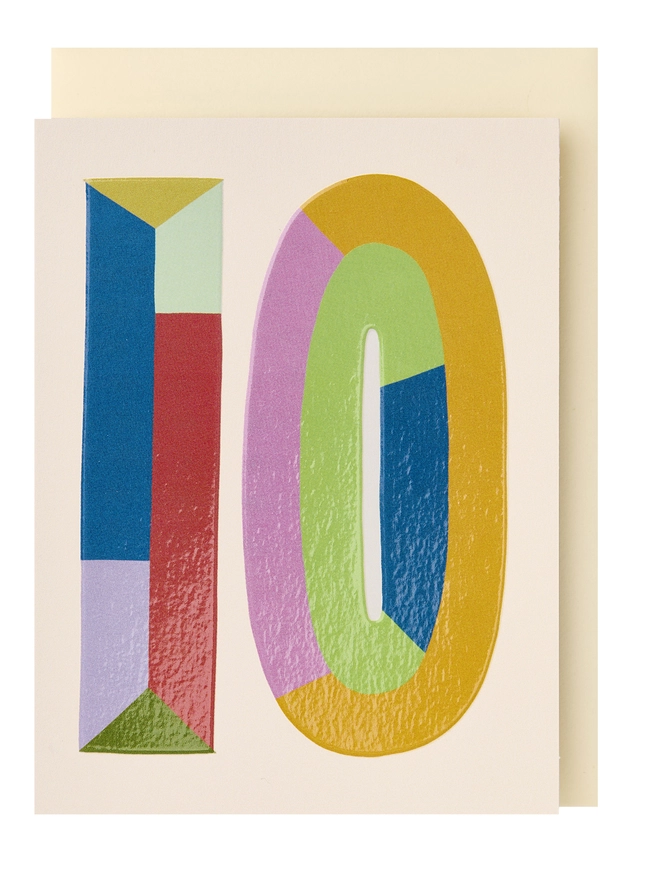A colourful mini greeting card featuring a colour block 10 in the centre with a cream background