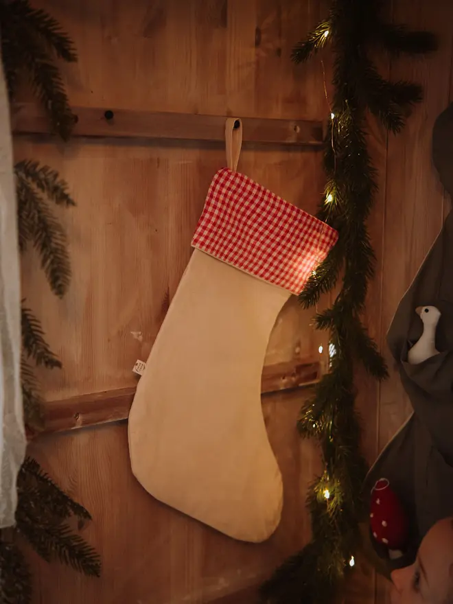 Decorative red stocking for Christmas tree and seasonal home styling Handmade red Christmas stocking ornament for festive nursery and home decor