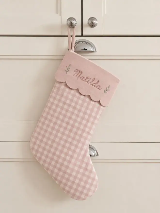 pink stocking with scalloped top and personalised embroidery