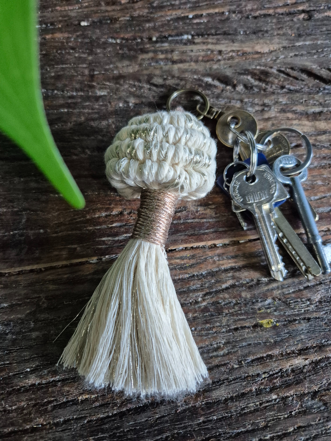 A fun, pretty and functional macrame mushroom keyring for bags, purses, keychains and also the perfect gift for a stylish friend, teachers gifts, nature-inspired enthusiasts