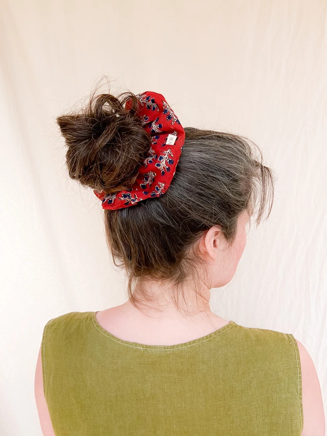 Model wearing large hair scrunchie