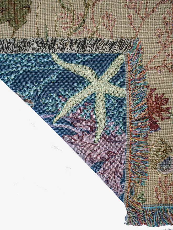 'Intertidal Sand' Recycled Cotton Blanket with a starfish on the back.