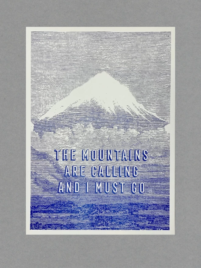Blue and white poster of a mountain with text reading 'The mountains are calling and I must go'