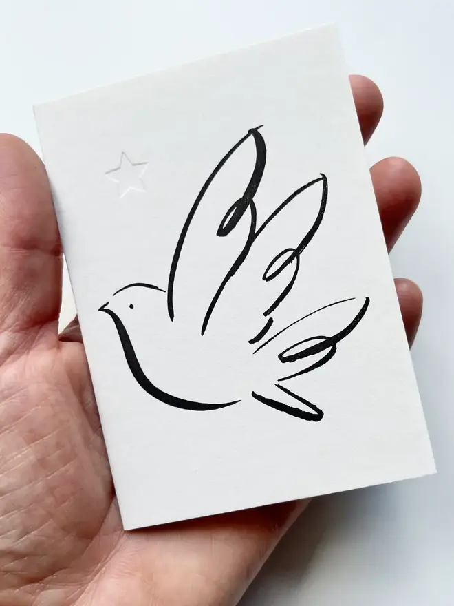 Letterpress Printed Peace Dove  Handcrafted. Black print on a white background. 