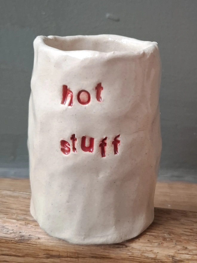 Ceramic Match Holder with the phrase 'Hot stuff' stamped into it 
