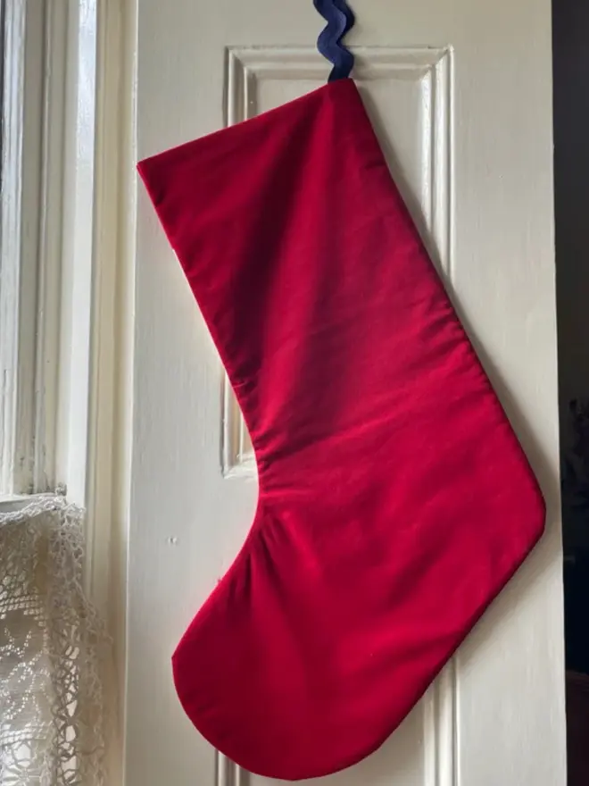 Aster Patchwork Stocking, hanging. 