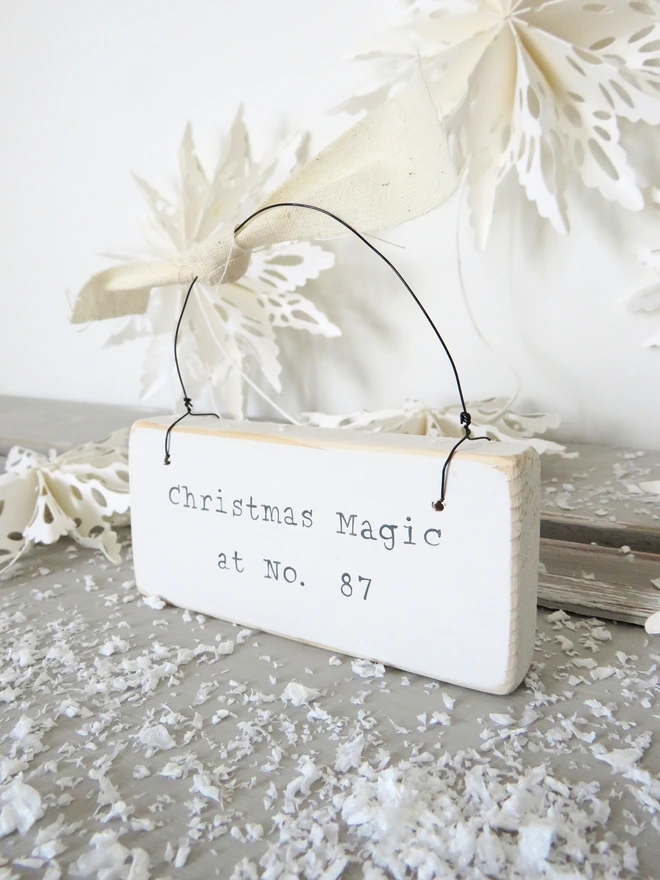 Chalky white painted wooden hanging sign with hand painted personalised Christmas Magic message