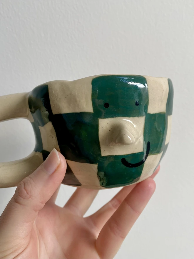 forest checkerboard mug close up