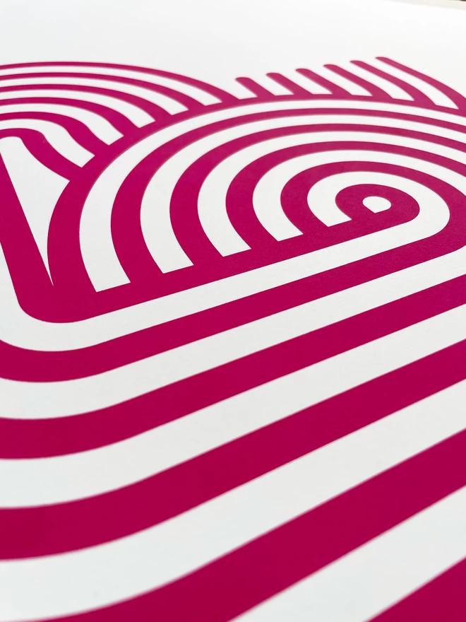 Close up of the stripy magenta heart screenprint design, parallel lines curve around to make a heart shape.