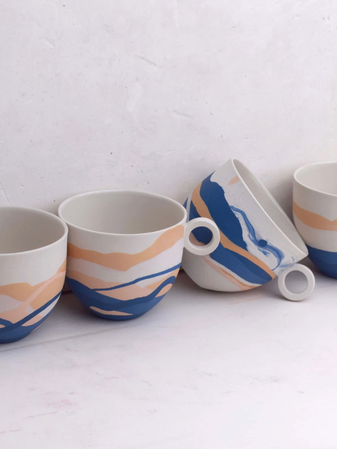 Shore Dreamlands Mug. A selection of mugs from the Shore Dreamlands collection, showing typical variation in decoration.