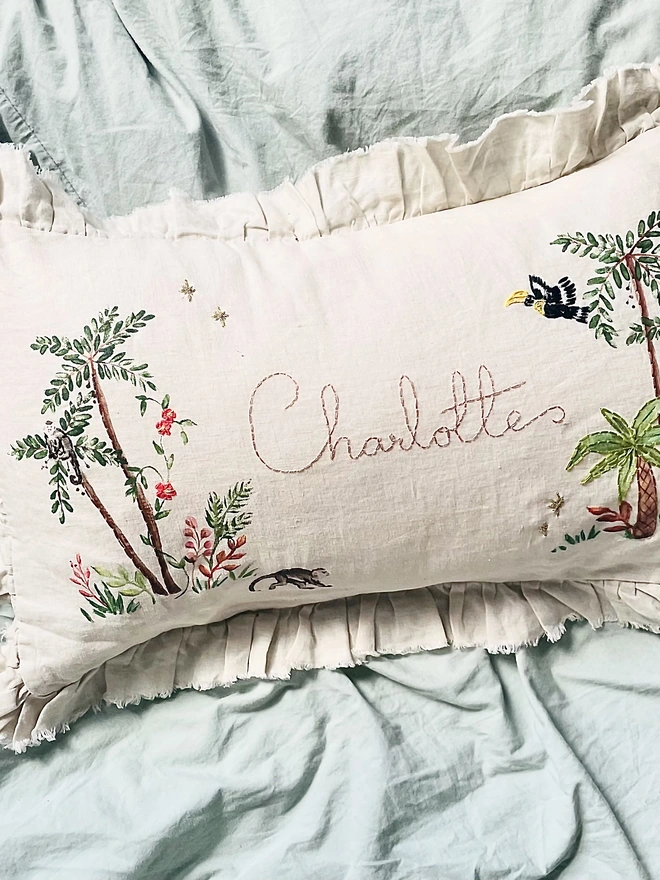 Hand Embroidered Tropical Jungle cushion on natural linen with personalised name 