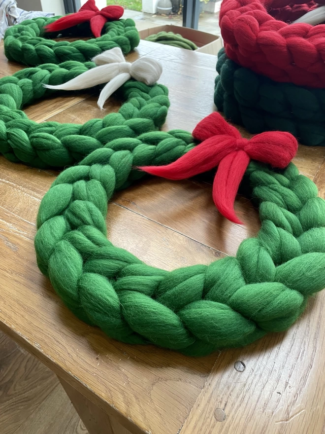forest green woolly wreath with red bow