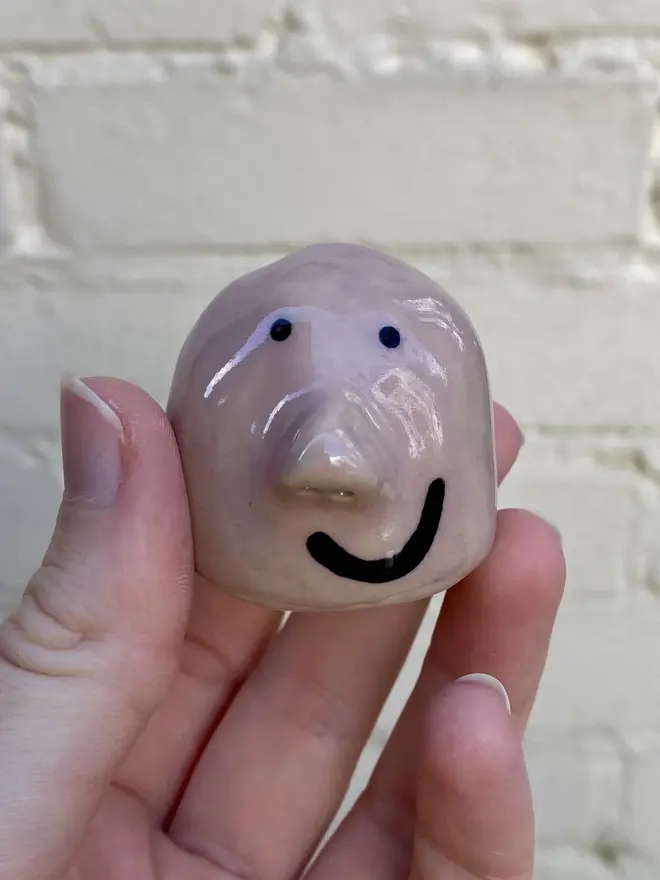 pink handmade ceramic buddy ornament