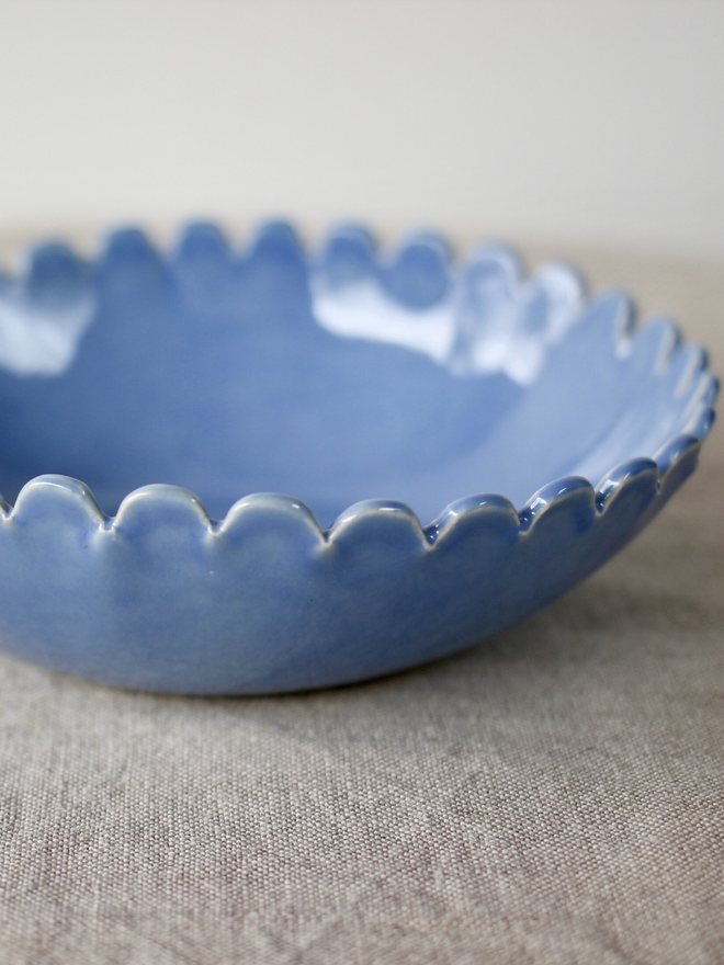 side view periwinkle blue daisy edge small serving bowl