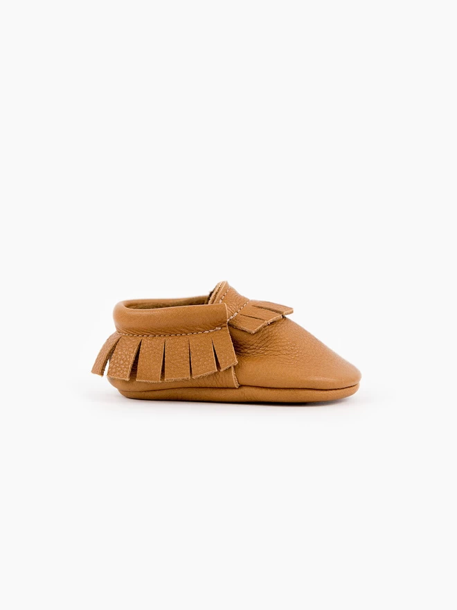 Side view of classic tan Amy and Ivor moccasins