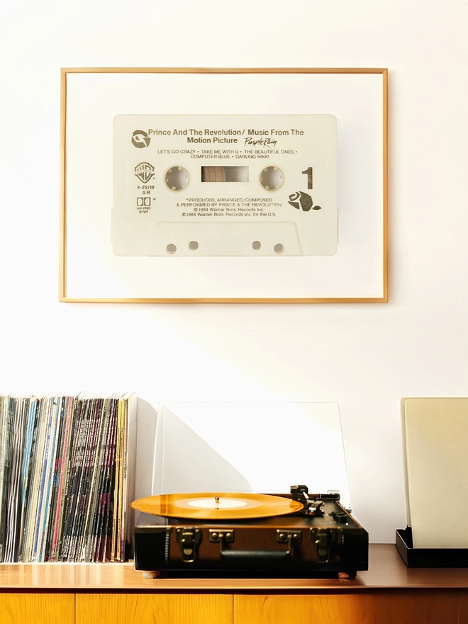 prince purple rain cassette tape print. framed print hung above record player and vinyl collection.