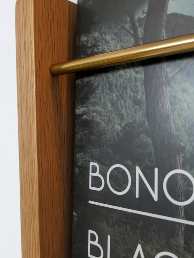 Compound Woodwork Shelf - Close Up of Brass Bar