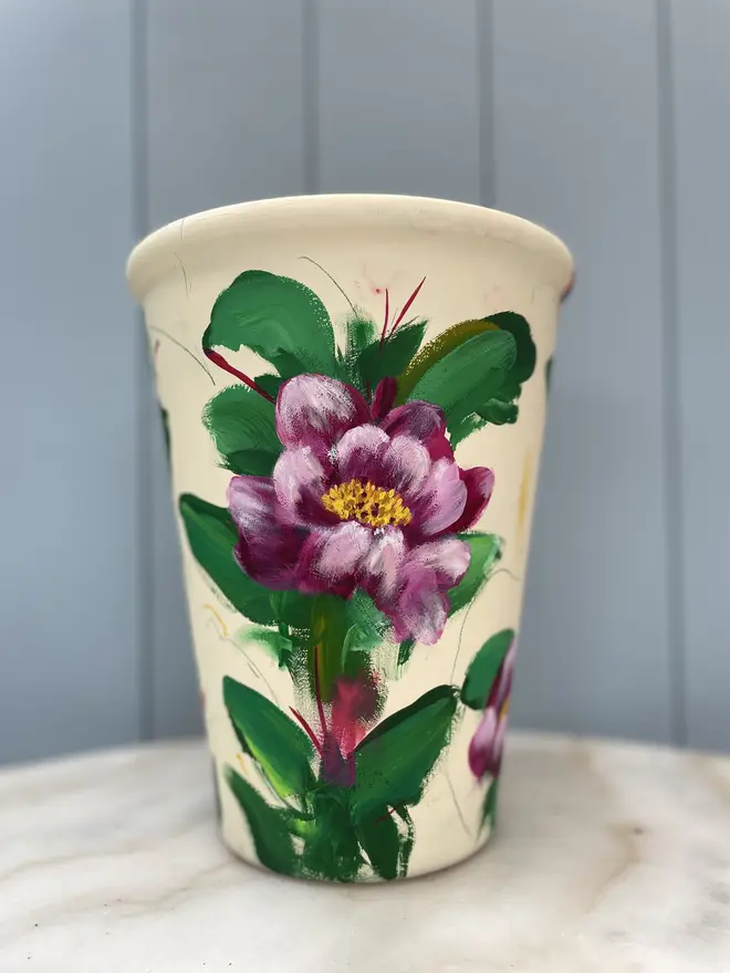 Unique hand-painted terracotta pot featuring pink peony on a cream background