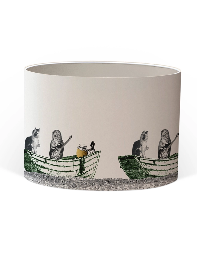 Handcrafted Owl and the Pussycat lampshade featuring a whimsical pea green boat illustration, bringing a touch of nostalgic storybook charm to the home.
