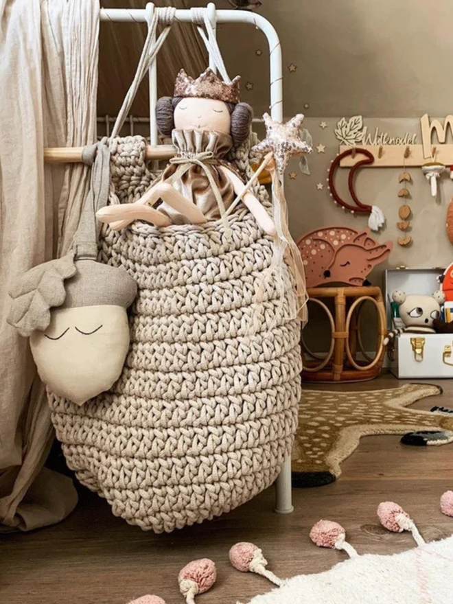 Zuri House. Large beige hanging basket.