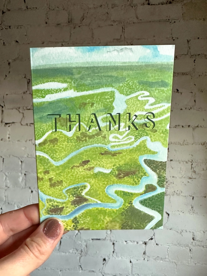 a greetings card featuring an illustration of the everglades landscape with the text “thanks”