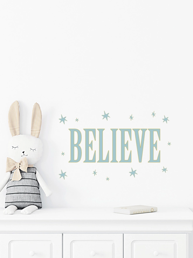 Believe wall stickers with stars surrounding wording in blue