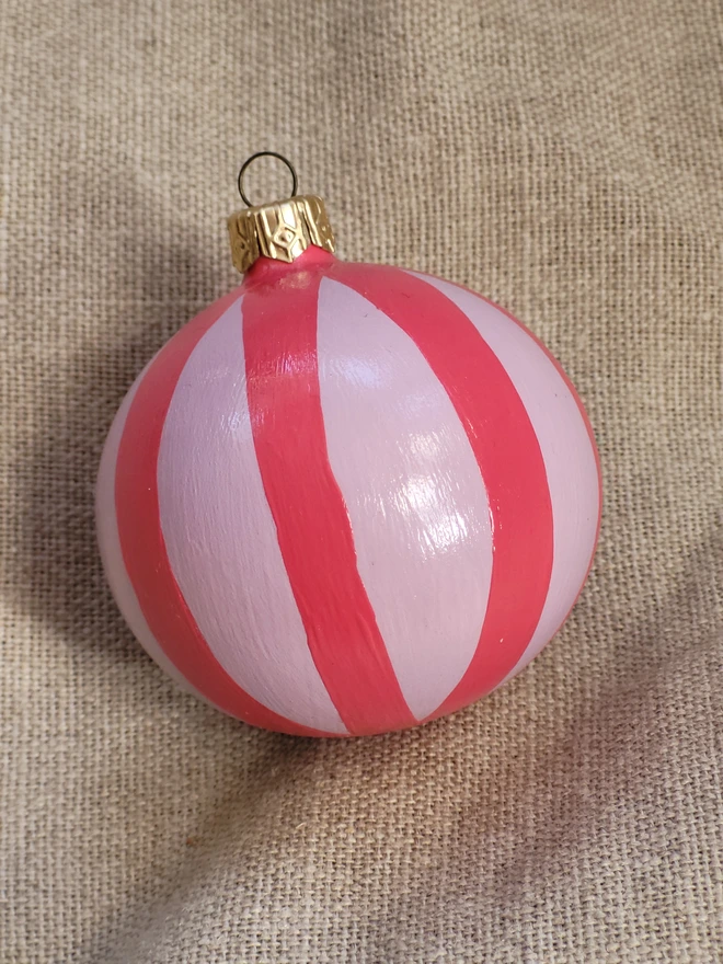 Pale pink bauble with bright pink stripes