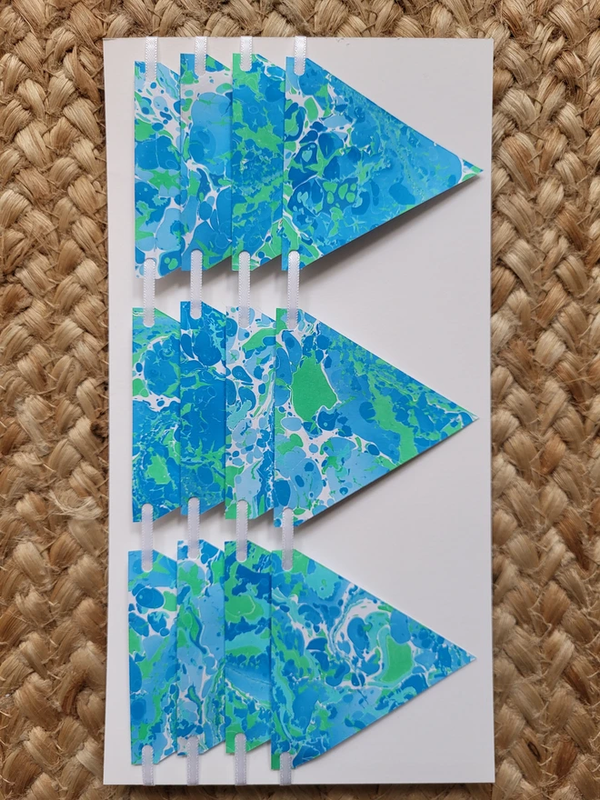 Hand-marbled paper bunting in blue and green tones