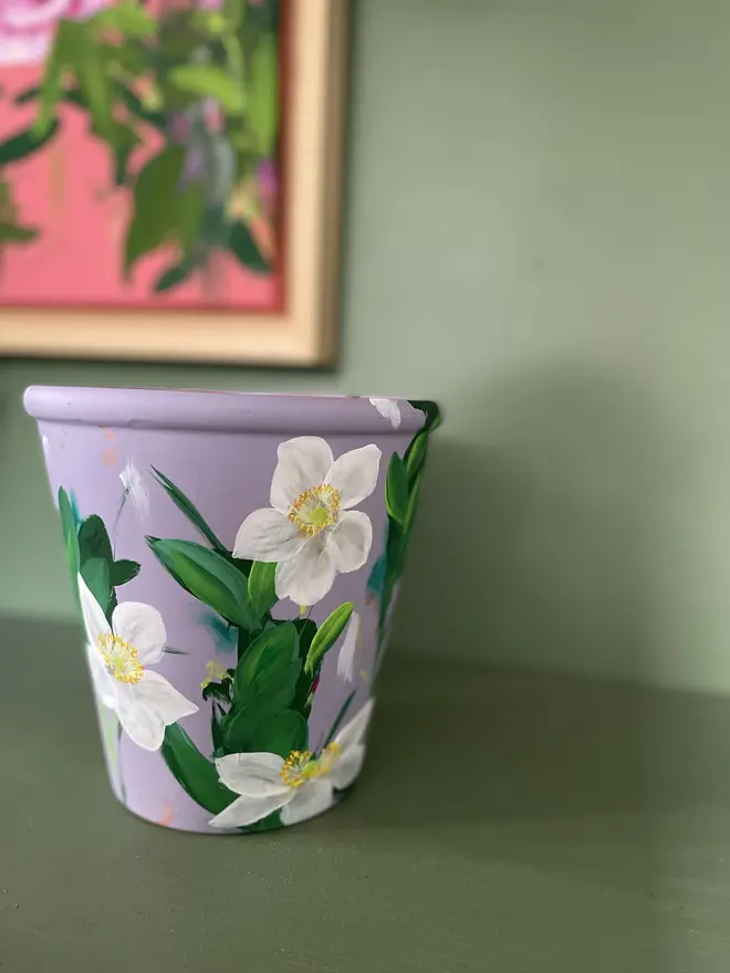 Hand painted floral plant pot lilc background with white anemone flowers