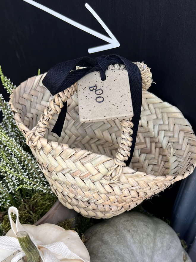 mini woven basket tied with a ceramic 'boo' tag