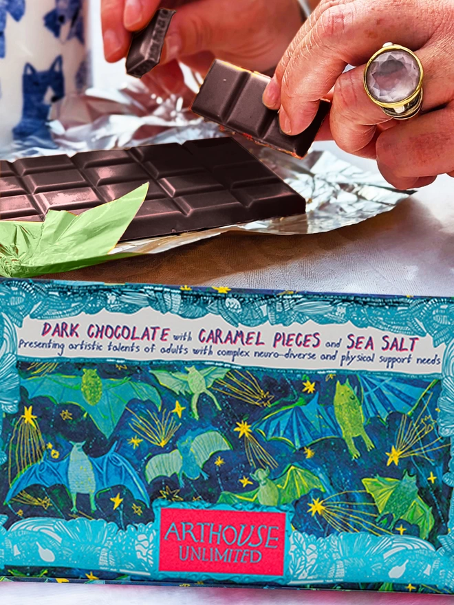 Charity dark chocolate bar with caramel & sea salt packaged in foiled card & green & blue bat design