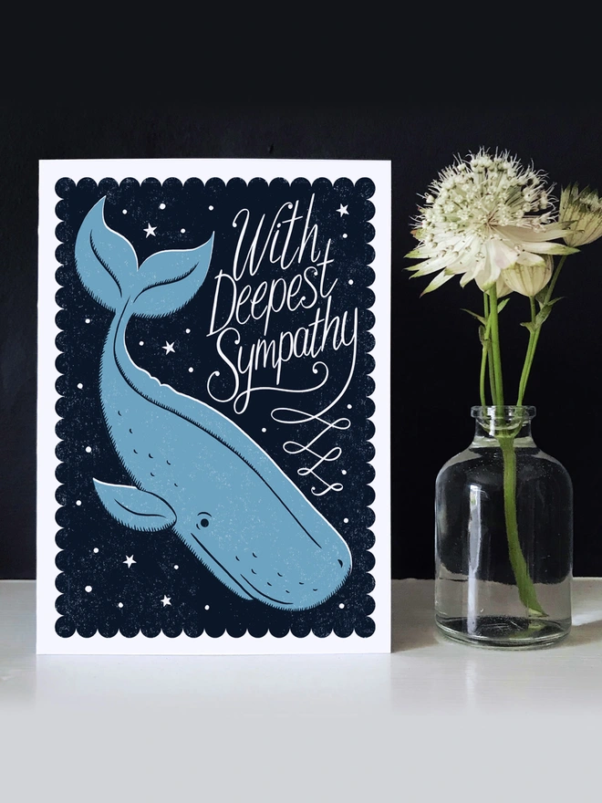 blue whale sympathy card against dark wall