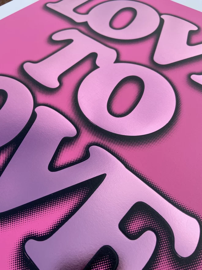 Metallic Hot Foil  "Love to Love" Screen Print in pink. typography says love to love with a drop shadow the print is square 