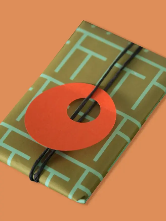 Geometric Lines Patterned Wrapping Paper, on an orange background. 