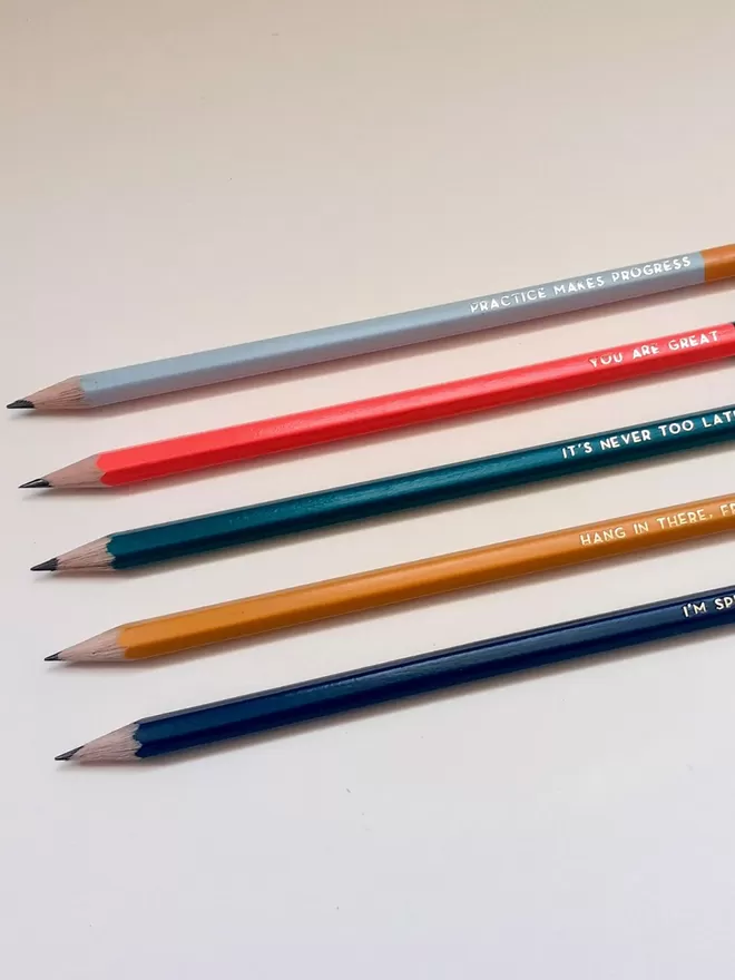 Pencils with the set messages lined up.