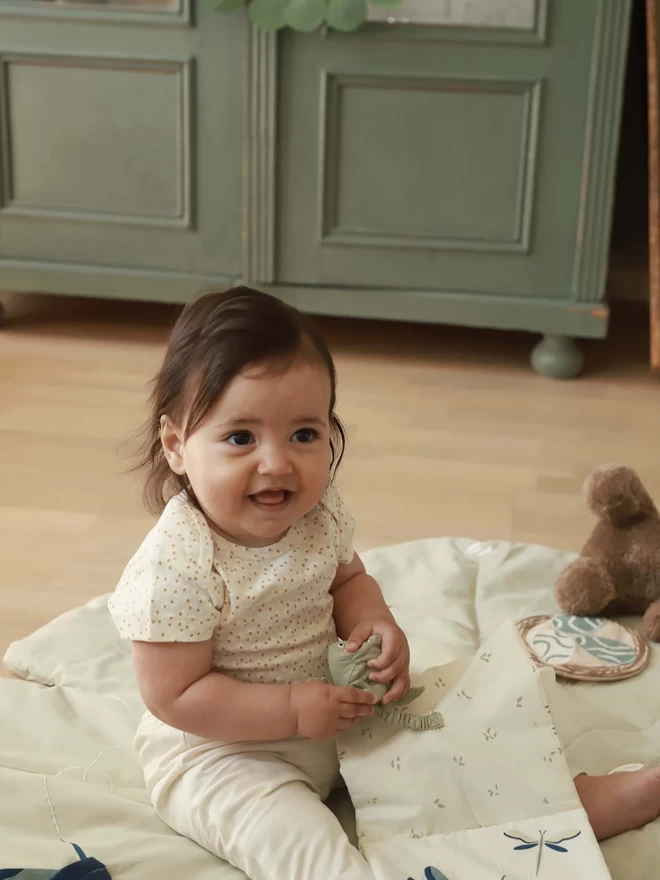 Baby fabric book held by a baby