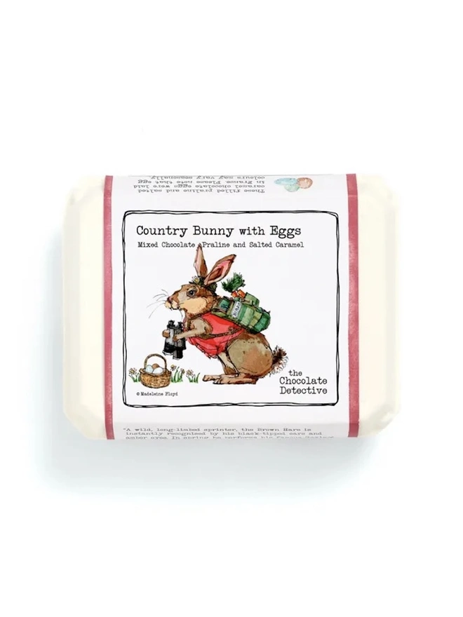 Country Bunny With Eggs (Box Of 12), a box of chocolate eggs on a white surface. 